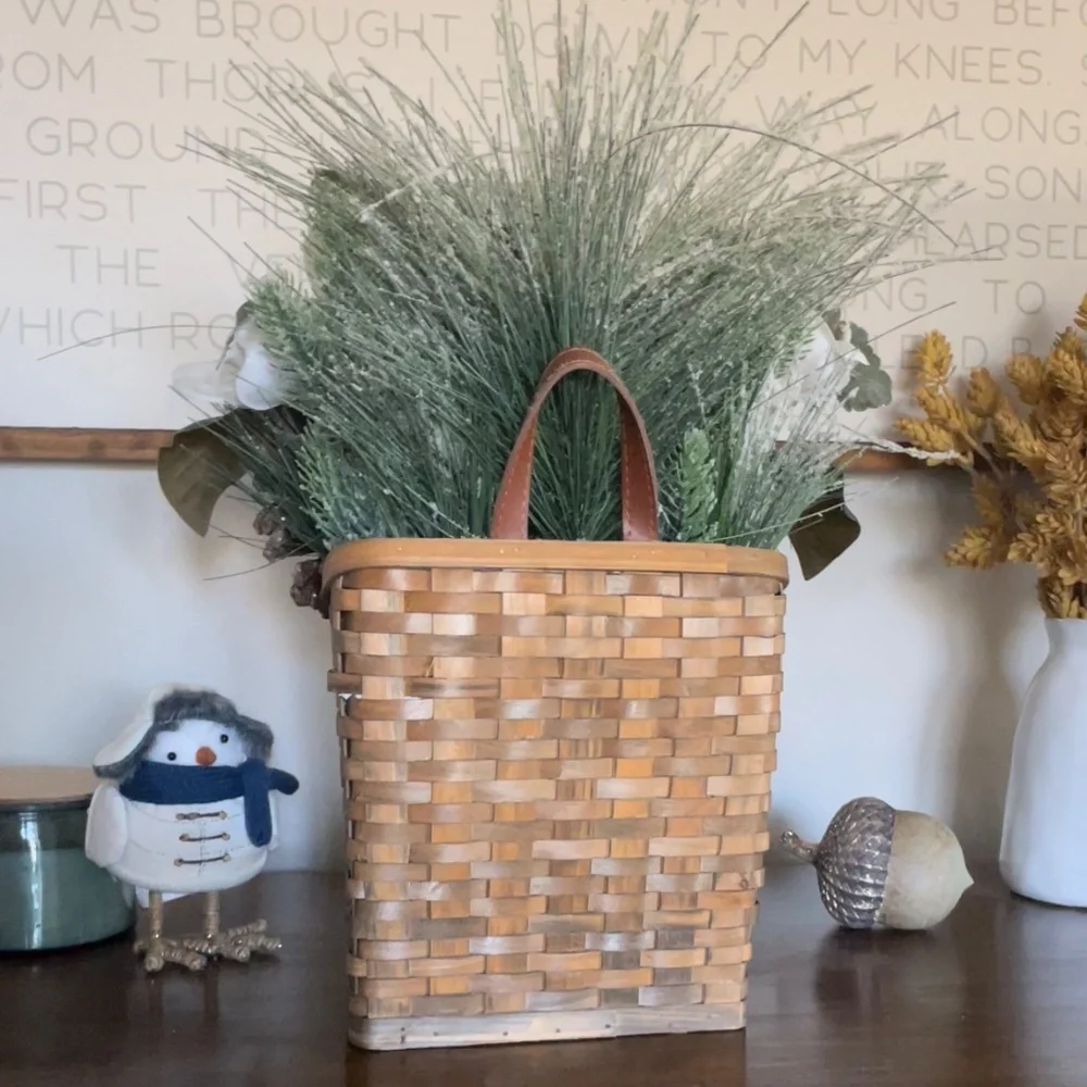 Winter hanging basket floral decor pinecones white flowers pine needles wreath